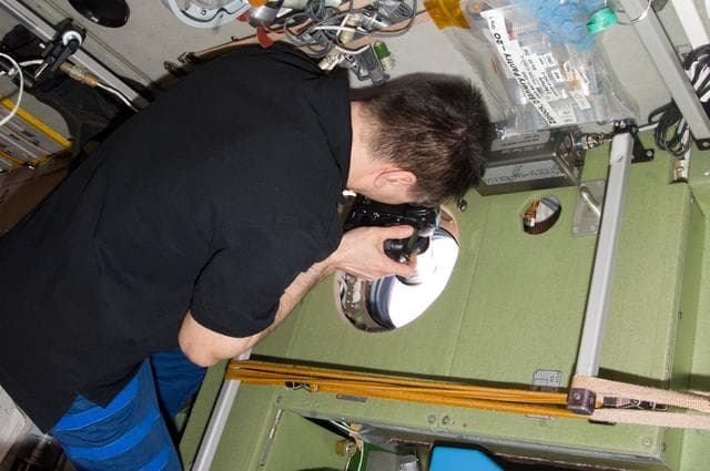 NASA image: Kononenko Uses a Camera in the SM