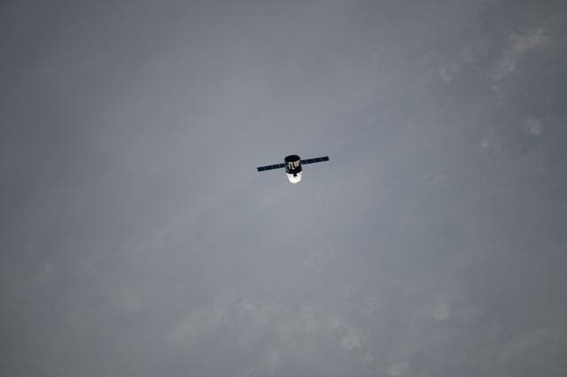 NASA image: Dragon Spacecraft during Flyunder Operations