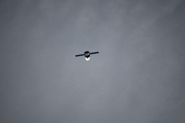 NASA image: Dragon Spacecraft during Flyunder Operations