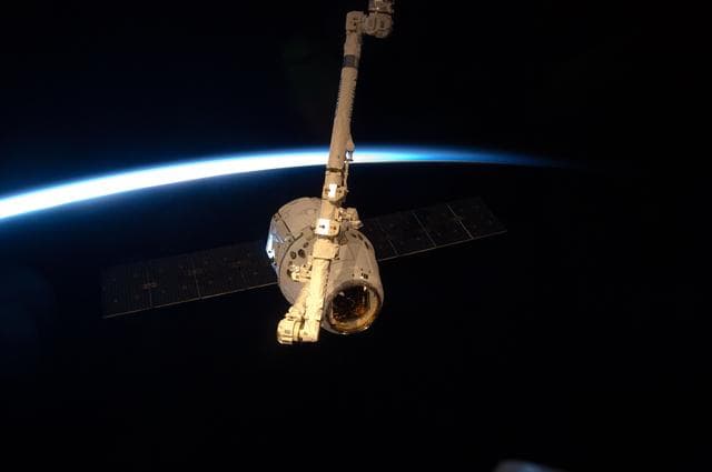 NASA image: Dragon Spacecraft grappled by SSRMS