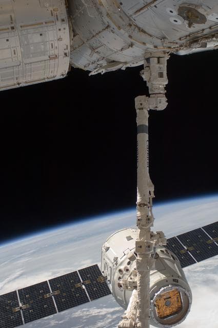 NASA image: Dragon Spacecraft grappled by SSRMS