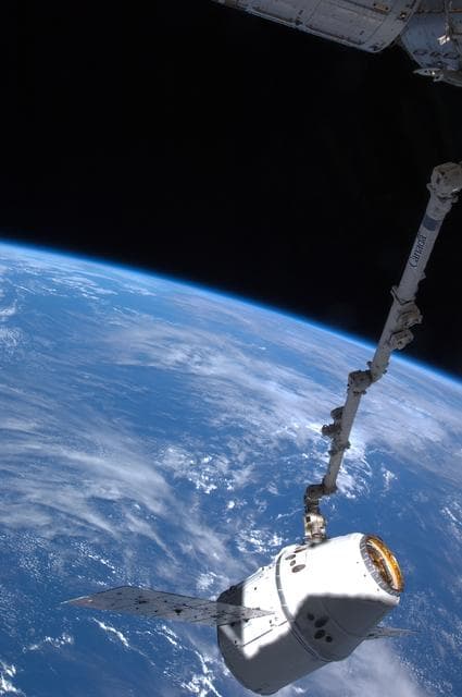 NASA image: Dragon Spacecraft grappled by SSRMS during Installation OPS