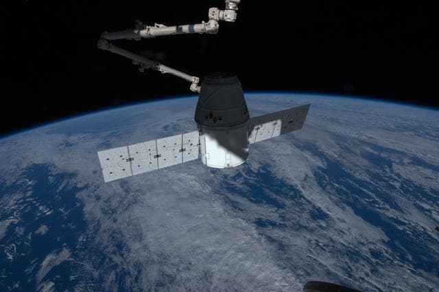 NASA image: Dragon Spacecraft grappled by SSRMS during Installation OPS