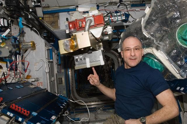 NASA image: Pettit during Amine Swingbed Valve Motor ORU Replacement