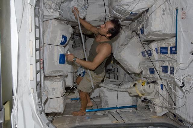 NASA image: Expedition 32 FE Acaba vacuums in the PMM