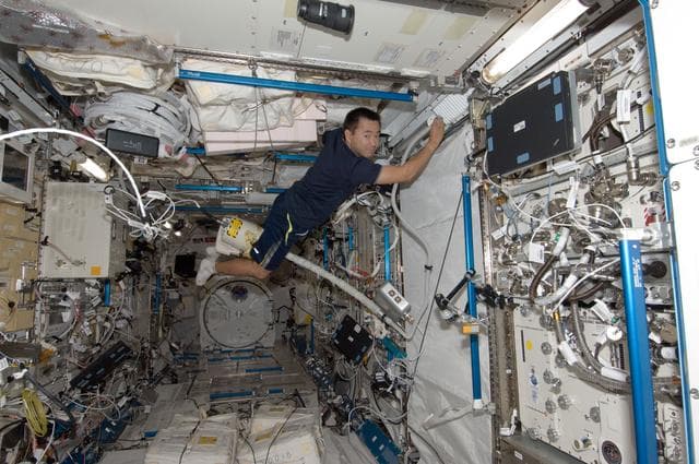 NASA image: Hoshide with vacuum cleaners in JPM