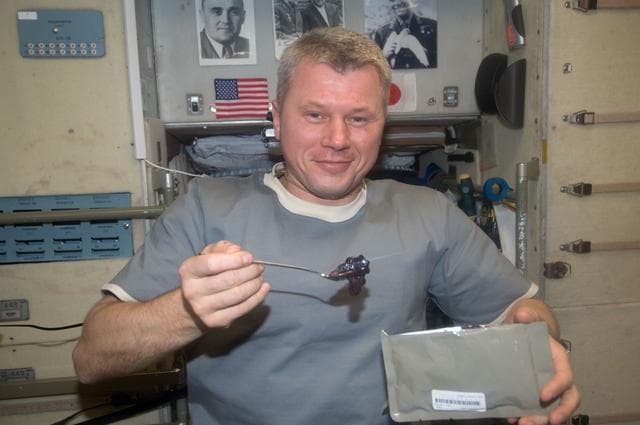 NASA image: Novitskiy eats snack in the SM