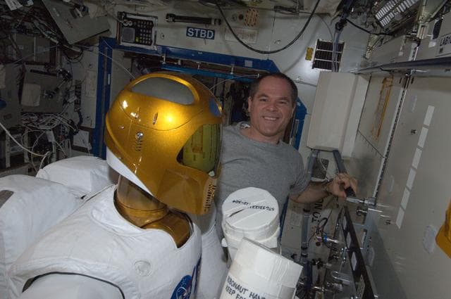 NASA image: Ford takes a boxing pose with Robonuat 2 humanoid robot in the U.S. Laboratory