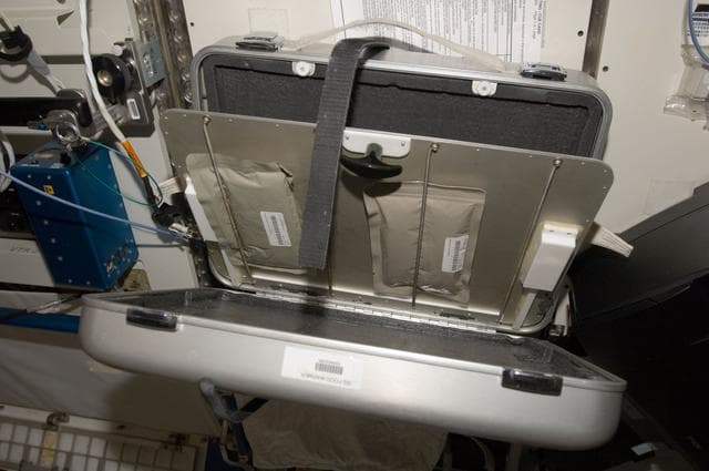 NASA image: Food Packets within suitcase