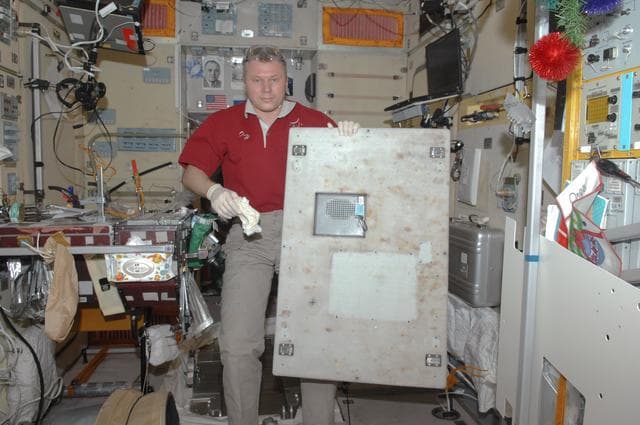 NASA image: Novitskiy during overlay panel installation in the SM