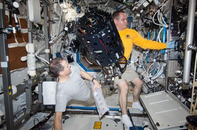 NASA image: Ford and Marshburn works at the CIR MDCA in the U.S. Laboratory