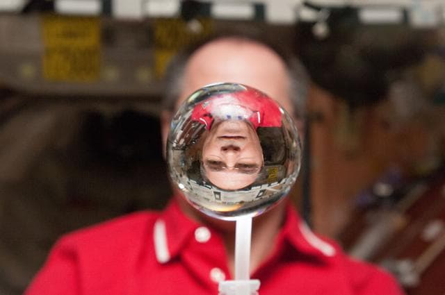 NASA image: Ford watches a water bubble float in the Node 1