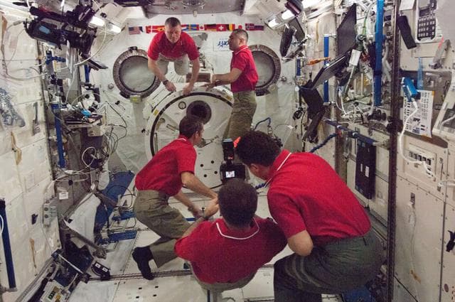 NASA image: Expedition 34 crewmembers in the JPM