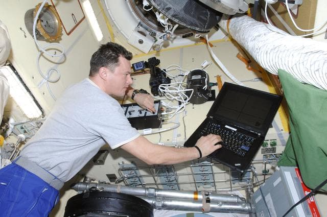 NASA image: Romanenko works with the Coulomb Crystal Experiment in the MRM-2