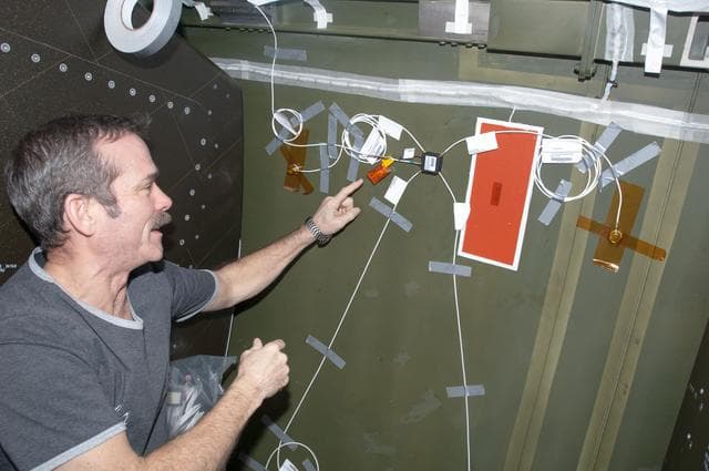 NASA image: Hadfield installing UBNT Sensors in the U.S. Laboratory