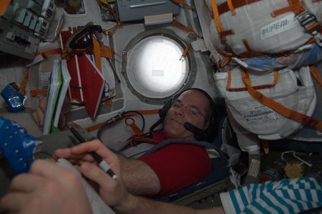 NASA image: Ford and Novitskiy during descent training in the Soyuz TMA-06M spacecraft