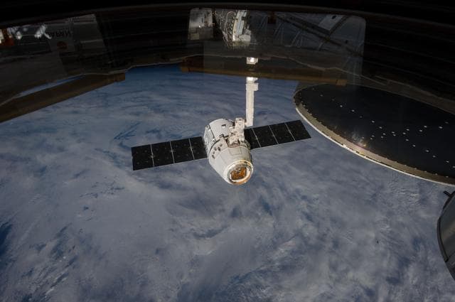 NASA image: Unberthed Dragon CRS-2 grappled by SSRMS