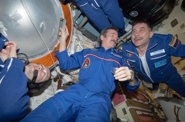NASA image: Crewmembers in MRM2 following Soyuz TMA-08M/34S Hatch Opening