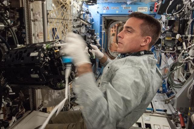 NASA image: Cassidy conducts MDCA Fuel Reservoir Remove and Replace OPS