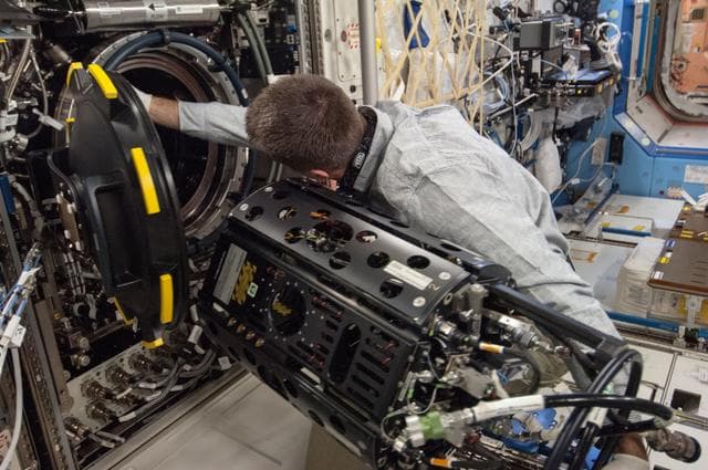NASA image: Cassidy conducts MDCA Fuel Reservoir Remove and Replace OPS