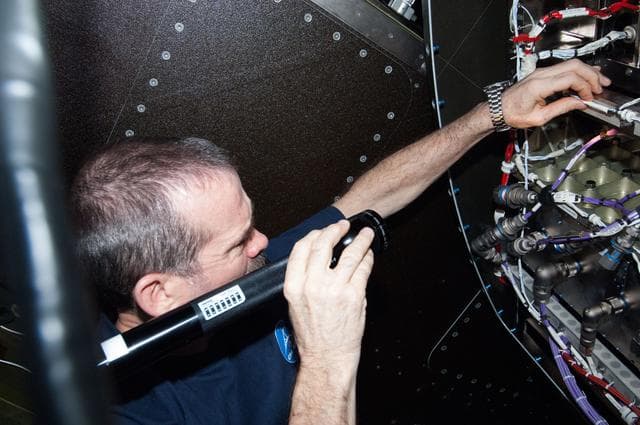 NASA image: Hadfield during HRCS Ku Comm Unit 1 Installation