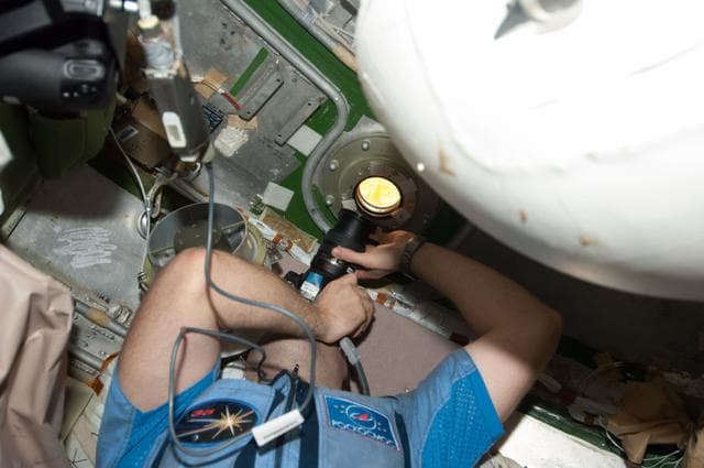 NASA image: Misurkin photographs Progress 51P Docking from SM Transfer Chamber