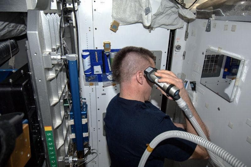 NASA image: Cassidy shaving his head