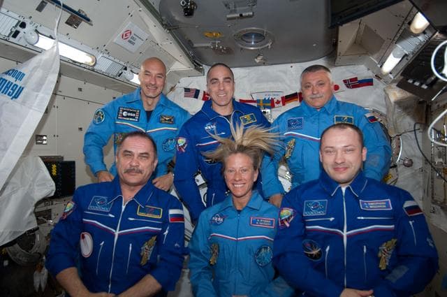 NASA image: Crew photo during set-up for a videotape tribute to the 50th anniversary  of the 1963 launch of Vostok-6.
