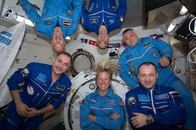 NASA image: Crew photo during set-up for a videotape tribute to the 50th anniversary  of the 1963 launch of Vostok-6.
