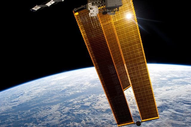 NASA image: Solar array and Earth