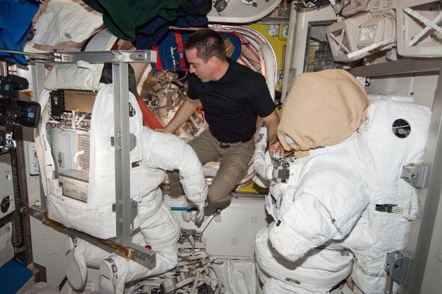 NASA image: Cassidy working EMU loop scrub