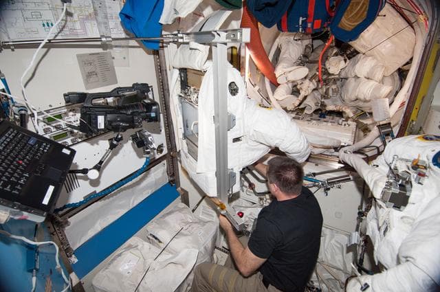 NASA image: Cassidy working EMU loop scrub