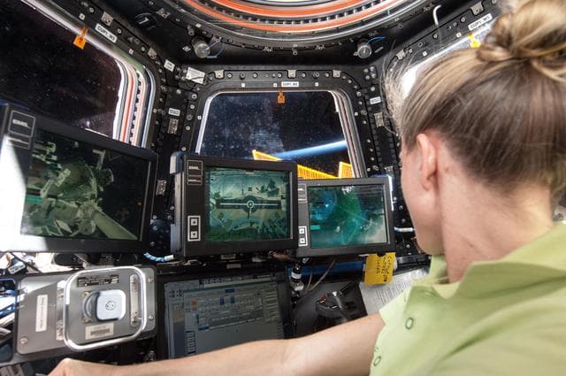 Nyberg at Robotics workstation in Cupola