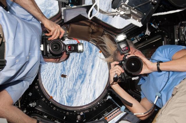 NASA image: Cassidy and Nyberg in Cupola during HTV-4 approach