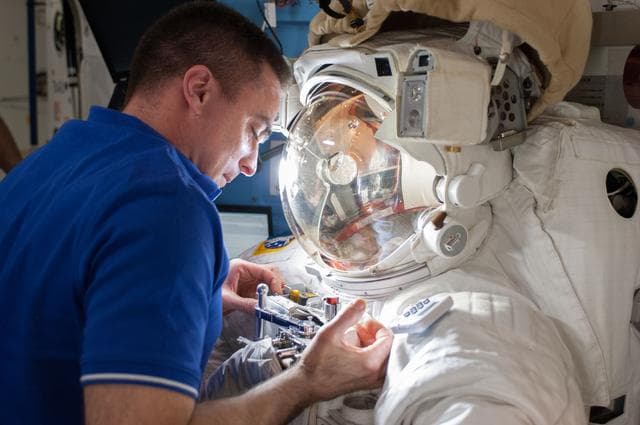NASA image: Quest airlock with malfunctioning EMU