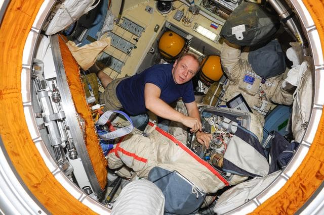 NASA image: Replacement of Orlan-MK No. 5 suit primary pump.