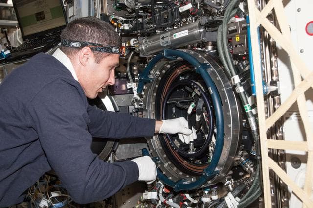 NASA image: Hopkins works with the MDCA inside the CIR in the U.S. Laboratory