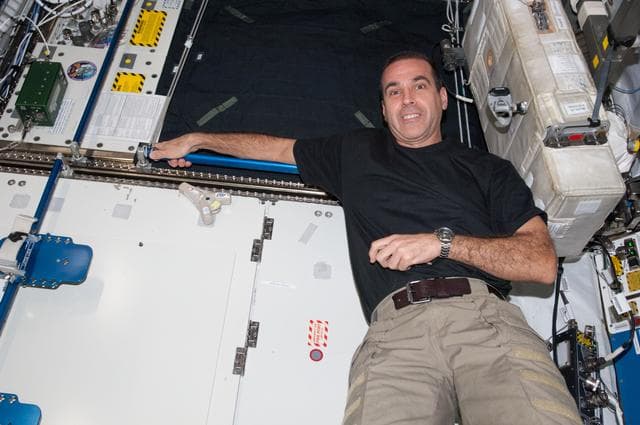 NASA image: Mastracchio poses with DIAPASON in the U.S. Laboratory