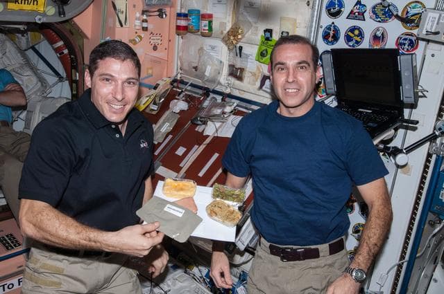 NASA image: Hopkins and Mastracchio enjoy meal in the Node 1