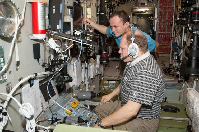 NASA image: Kotov and Ryazanskiy at TORU Docking System Controls in the SM