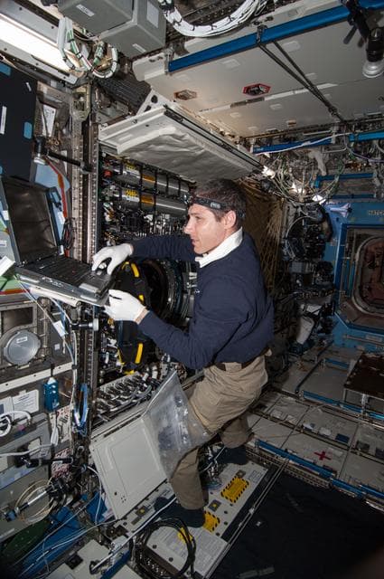 NASA image: Hopkins works with the MDCA hardware replacement, and CIR maintenance