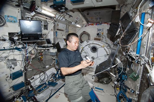 NASA image: Wakata performs microscopic analysis of the NanoRacks Module-38 Petri Dishes