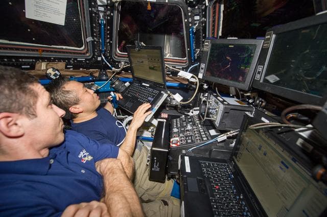 NASA image: Hopkins and Wakata during Cygnus Spacecraft Unberthing