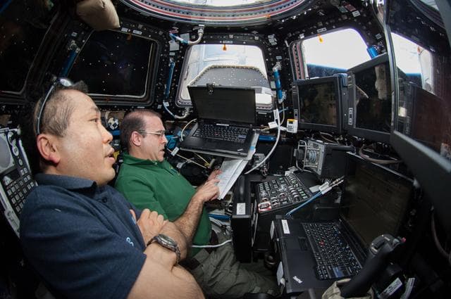 NASA image: Wakata and Mastracchio monitor Dragon Spacecraft Approach from the Cupola