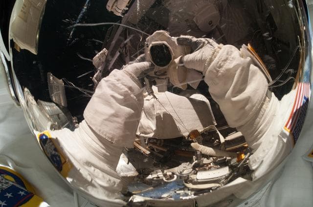 Mastracchio photographs his helmet during EVA 26