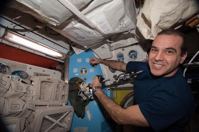 NASA image: Mastracchio signs Mission Patch in A/L