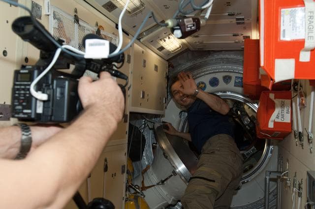 NASA image: Crewmembers enter Soyuz TMA-11M Spacecraft