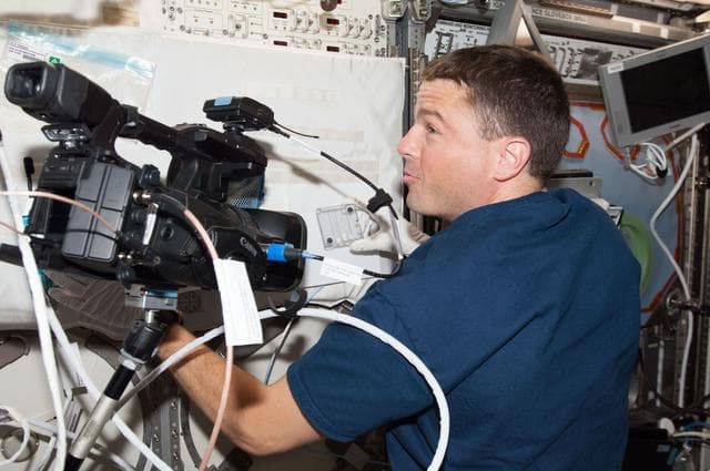 NASA image: Wiseman in with ACE sample