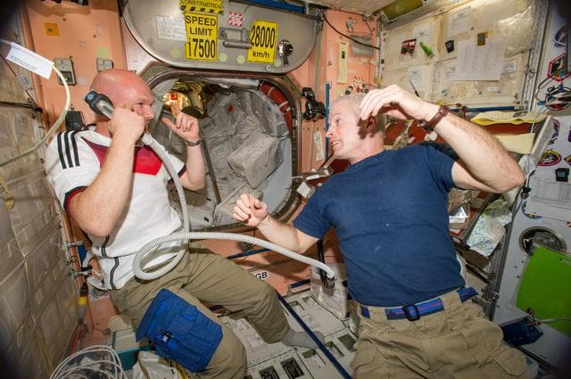 NASA image: Expedition 40 crew in Node 2 after German - U.S. soccer game