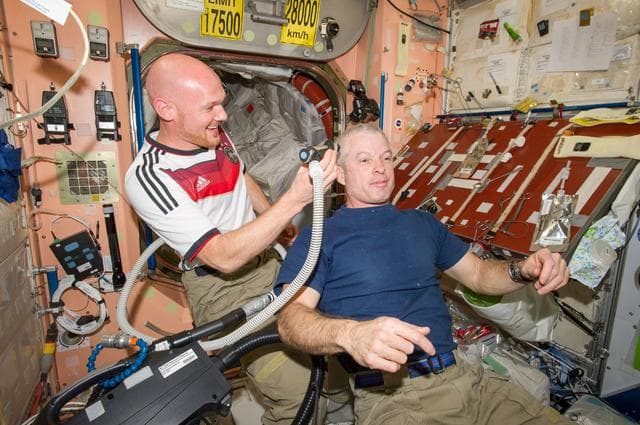 NASA image: Expedition 40 crew in Node 2 after German - U.S. soccer game